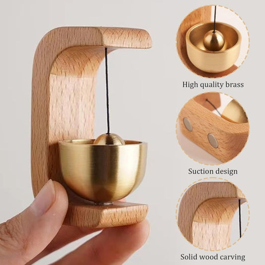Wooden door bell with decorative design from FIZZI SHOP, featuring a rustic, handcrafted appearance and traditional hanging bell.
