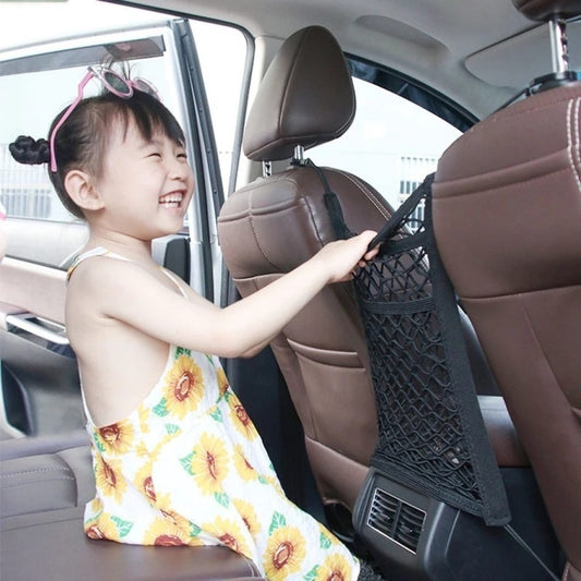 FIZZI SHOP 3-layer mesh car storage net with multiple compartments hanging in a vehicle for organizing belongings.
