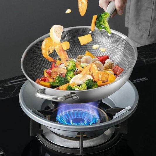 FIZZI SHOP Gas Saver Stove Protector Stand shown on kitchen stove, designed to protect surfaces and improve safety during cooking.