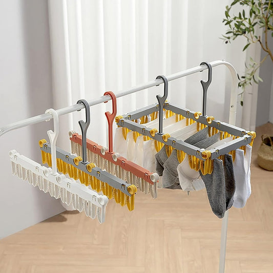 Foldable cloth dryer hanger by FIZZI SHOP, showing a compact, foldable metal and plastic hanger for drying clothes efficiently.