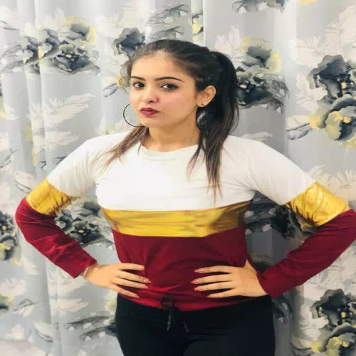 Multi-colored striped women’s top by FIZZI SHOP featuring classic multi-stripe design and comfortable fit.