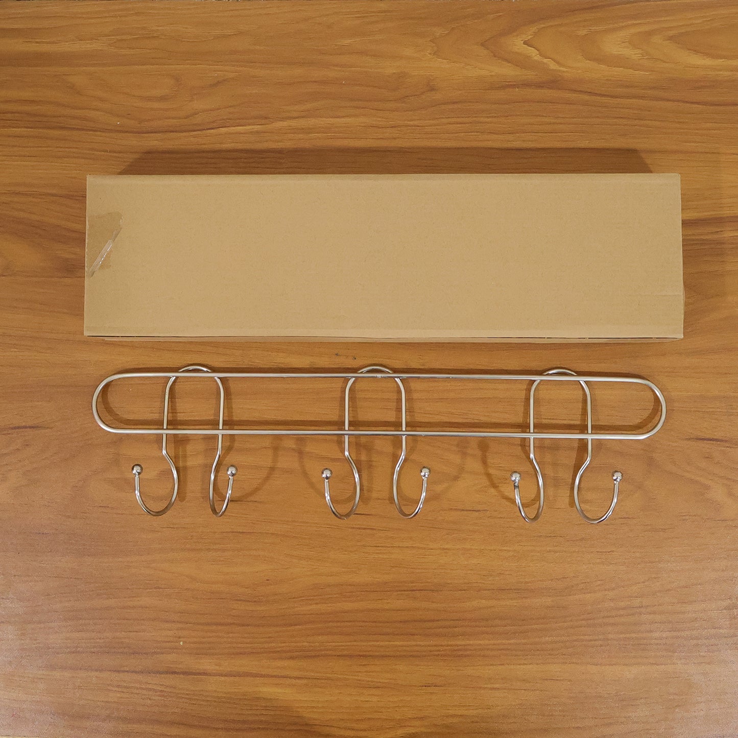 Wall-mounted metal multi-hook rack by Wukusy, featuring several sturdy hooks for organizing keys, coats, or accessories.