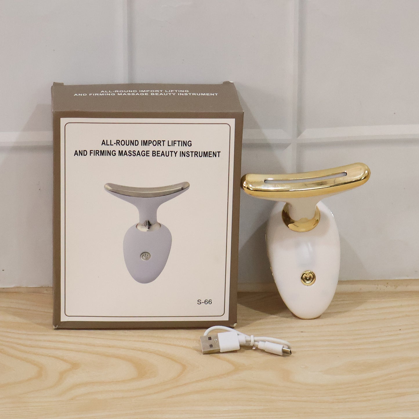 Wukusy electric neck and face massager device for lifting and firming skin, shown in use on the face and neck area.