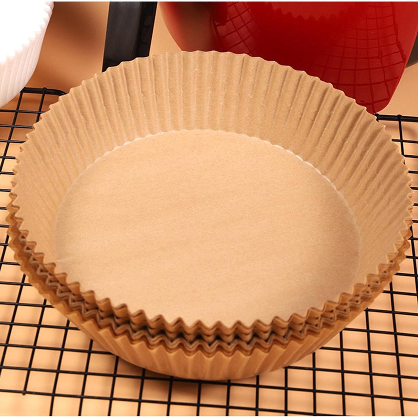 Set of 50 round Wukusy disposable paper liners for air fryers, 160mm x 45mm, ideal for home and kitchen cooking.