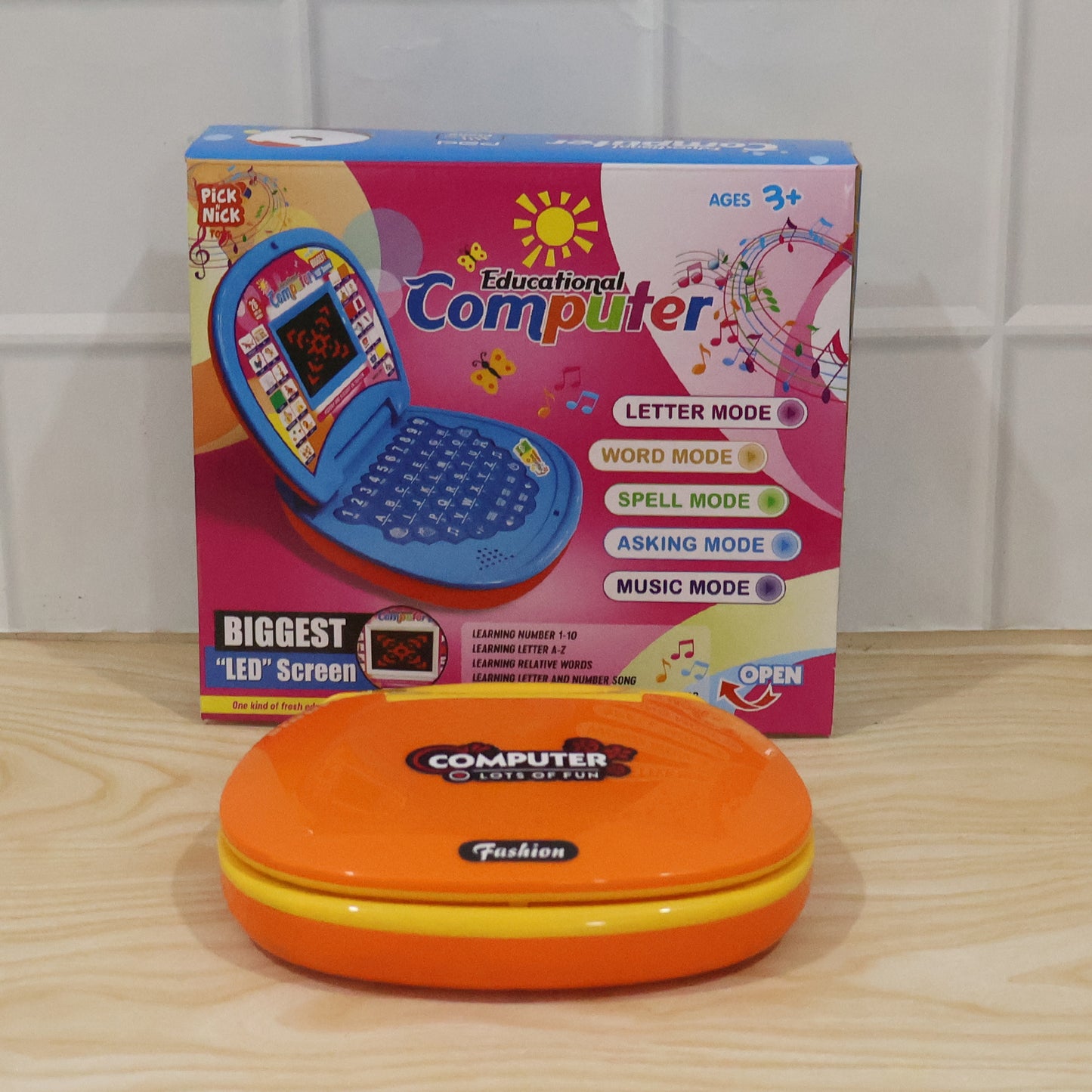 Wukusy kids educational laptop toy with colorful numbers, alphabets, and music features for early learning and fun.