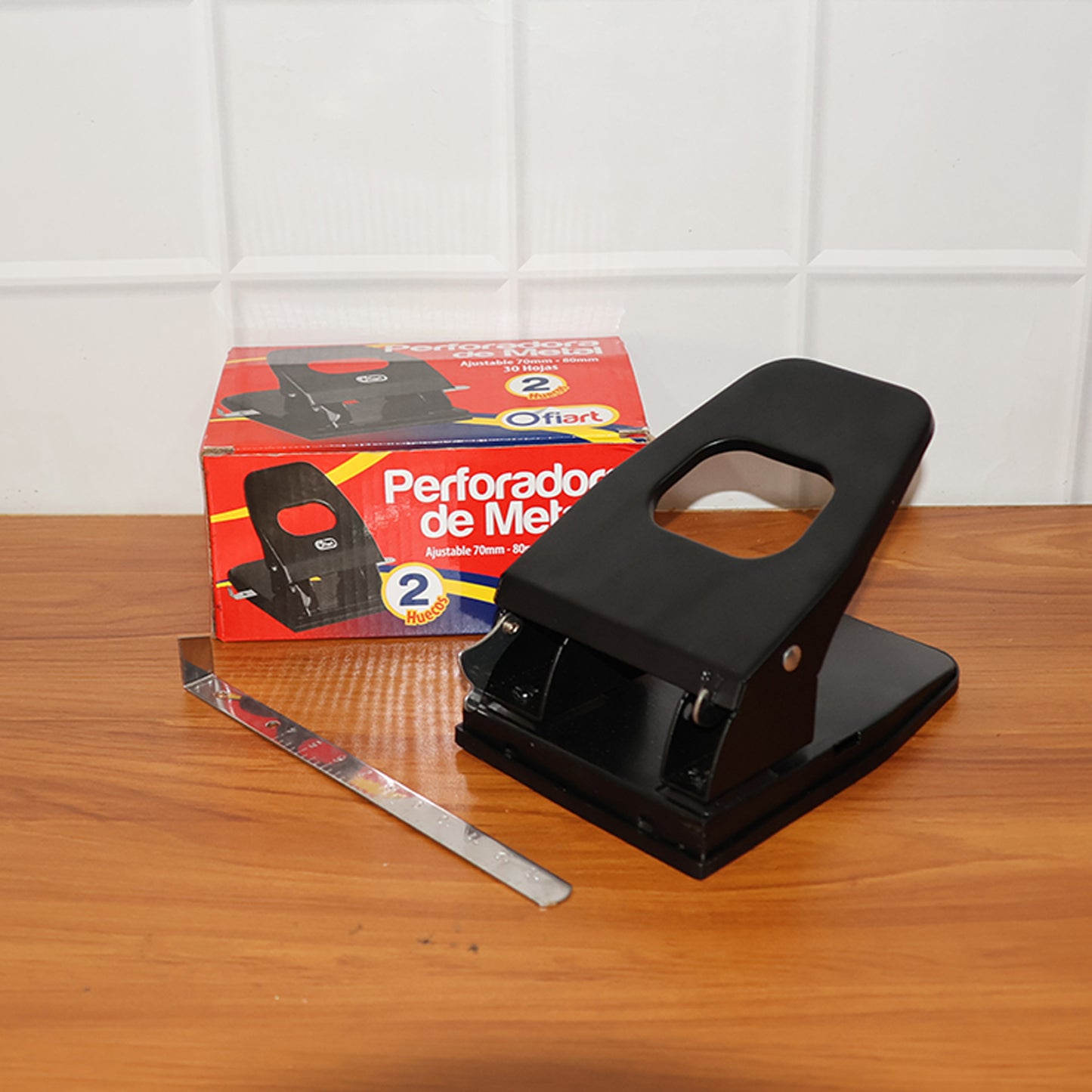 Heavy-duty Wukusy metal 2-hole paper punch machine for office use, showing the durable metal construction and two-hole punching mechanism.