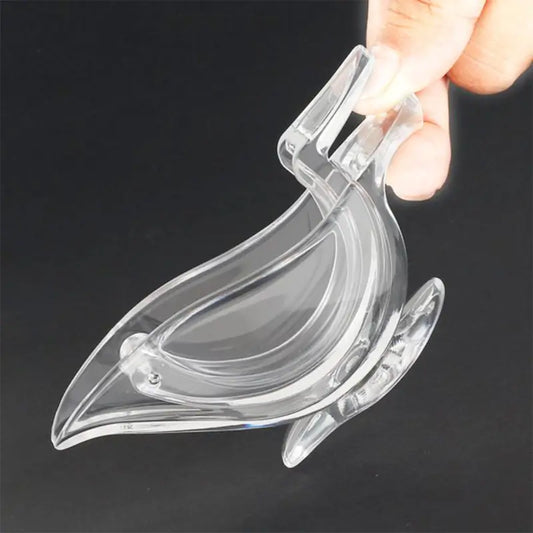 Ekom manual lemon slice squeezer, portable transparent bird-shaped citrus juicer for oranges, lemons, and limes in a kitchen setting