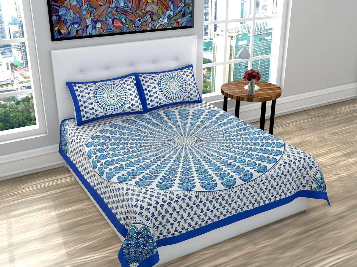 Jaipuri printed cotton double bedsheet with vibrant traditional patterns and colorful floral designs, draped over a bed.