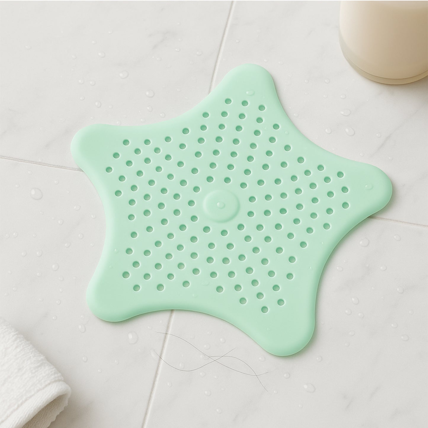 Mint green silicone star-shaped sink filter by Wukusy, bathroom hair catcher drain strainer for basin sinks.