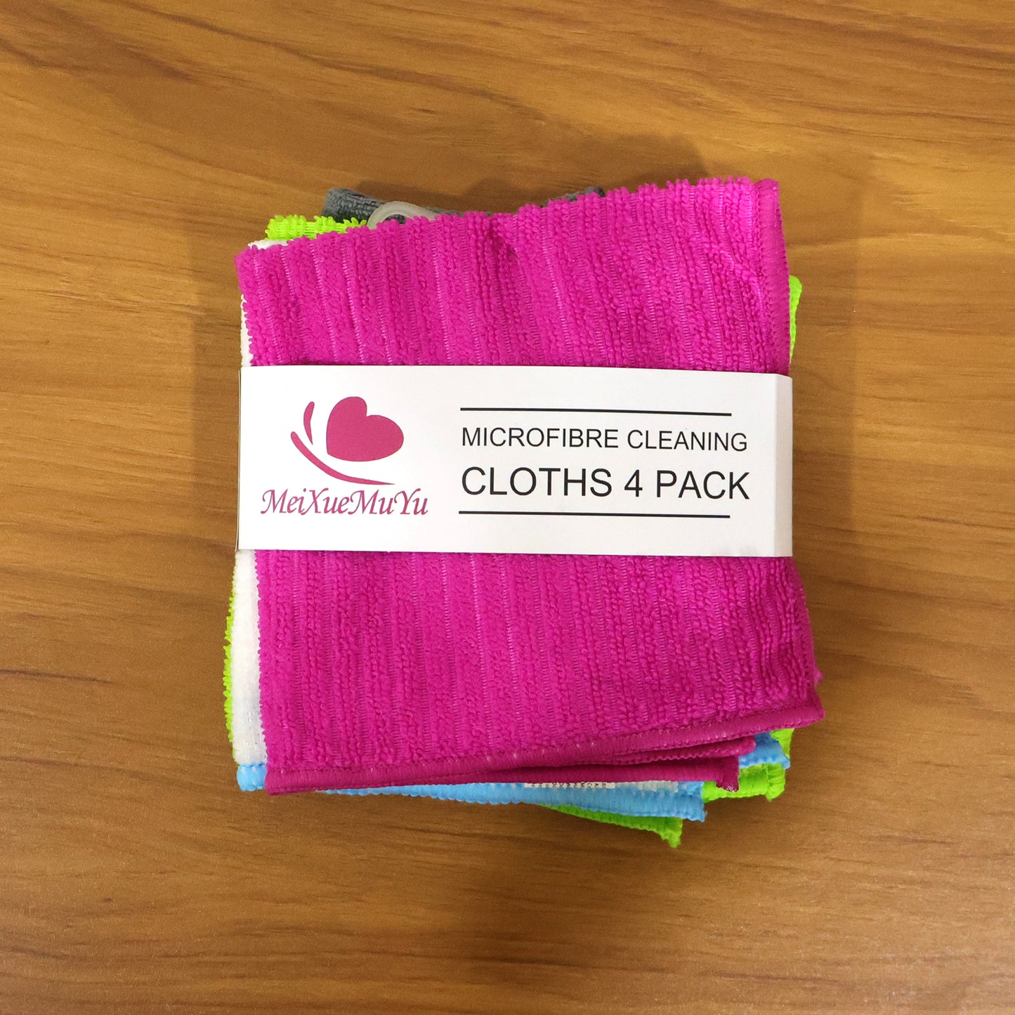 Set of four Wukusy microfiber cleaning cloths, soft and absorbent for kitchen, glass, and surface cleaning.
