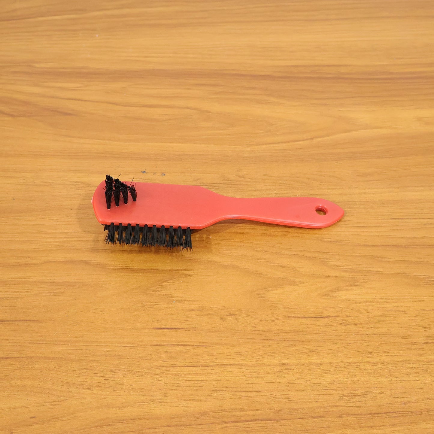 Wukusy multipurpose shoe cleaning brush with wooden handle and bristles for scrubbing shoes and sneakers.