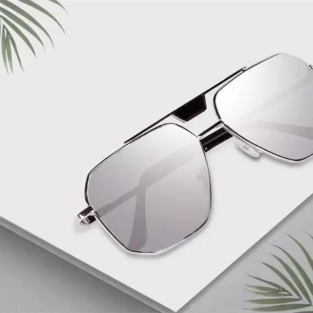 Silver sunglasses inspired by latest trends, stylish design, and reflective lenses, branded by Drpshippr.