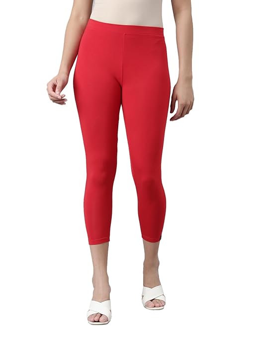 Red skinny fit high ankle length leggings from FIZZI SHOP, shown laid flat highlighting the snug fit and high ankle design.