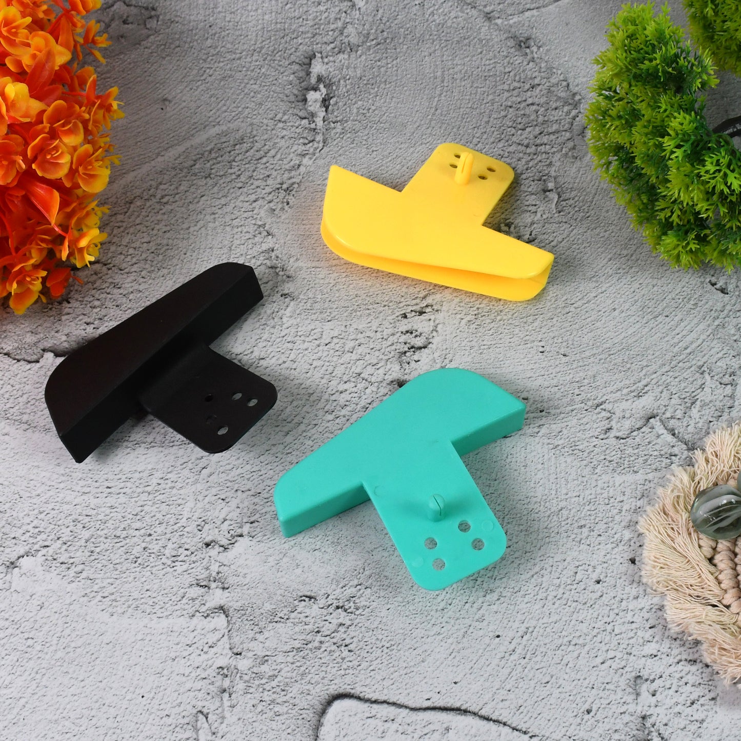 Wukusy plastic mobile phone charging stand holder in mixed colors, compact and secure for desk or bedside use.