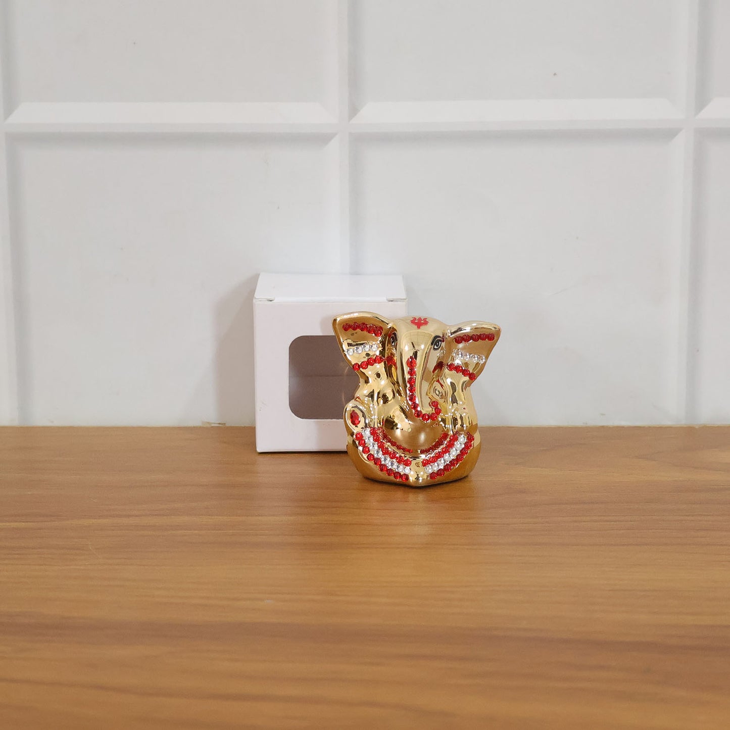 Golden Lord Ganesha idol decorative showpiece by Wukusy, featuring intricate craftsmanship and vibrant gold finish.