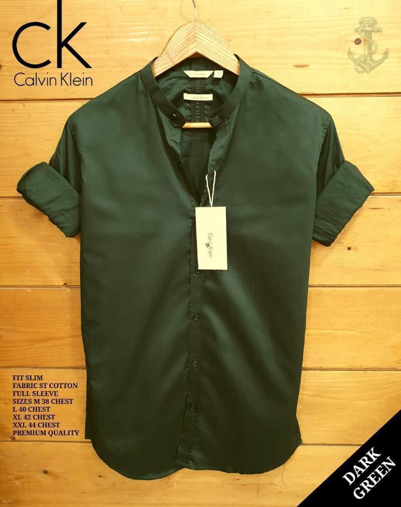 Dark green men's Ben collar shirt by Seasons, shown with button-down front and long sleeves, made from comfortable fabric.