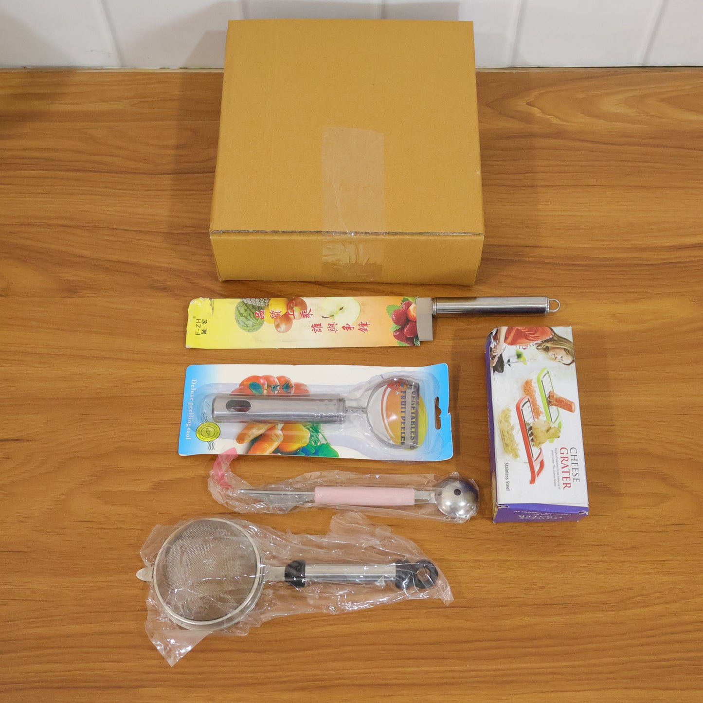 Wukusy 5-in-1 multipurpose kitchen tool set with various utensils for cooking, slicing, and food preparation.