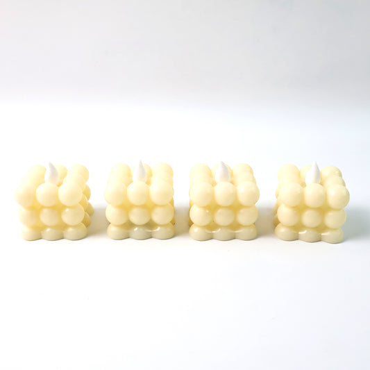 Set of four decorative LED bubble candles by Wukusy, designed for home decor with glowing, bubble-like features.