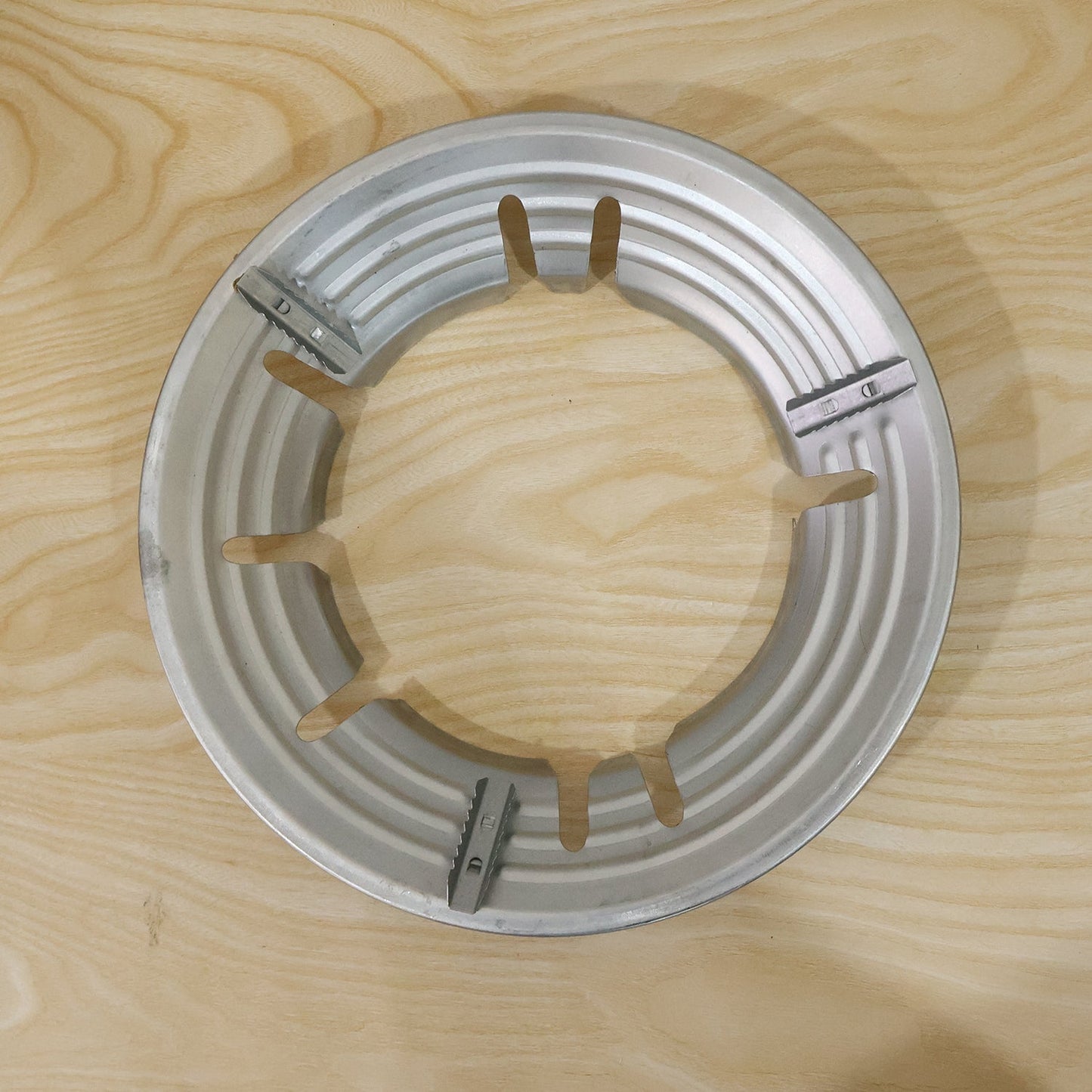 Stainless steel wok support ring and trivet for gas stove burner by Wukusy, with a sturdy, circular design for cookware stability.