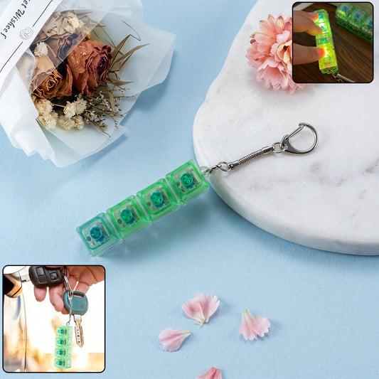 Wukusy mechanical keyboard switch keychain showcasing a realistic small-scale switch with colorful stem details.