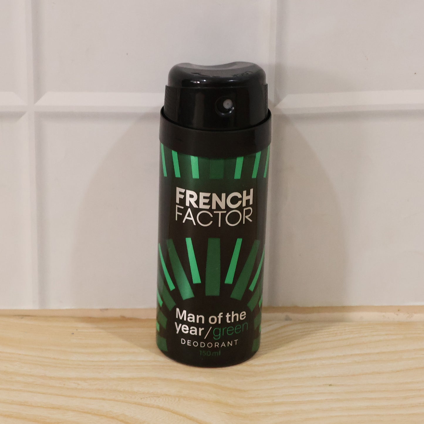 Wukusy French Factor Man Of The Year green body spray bottle, 150ml, with sleek packaging and fresh scent design.
