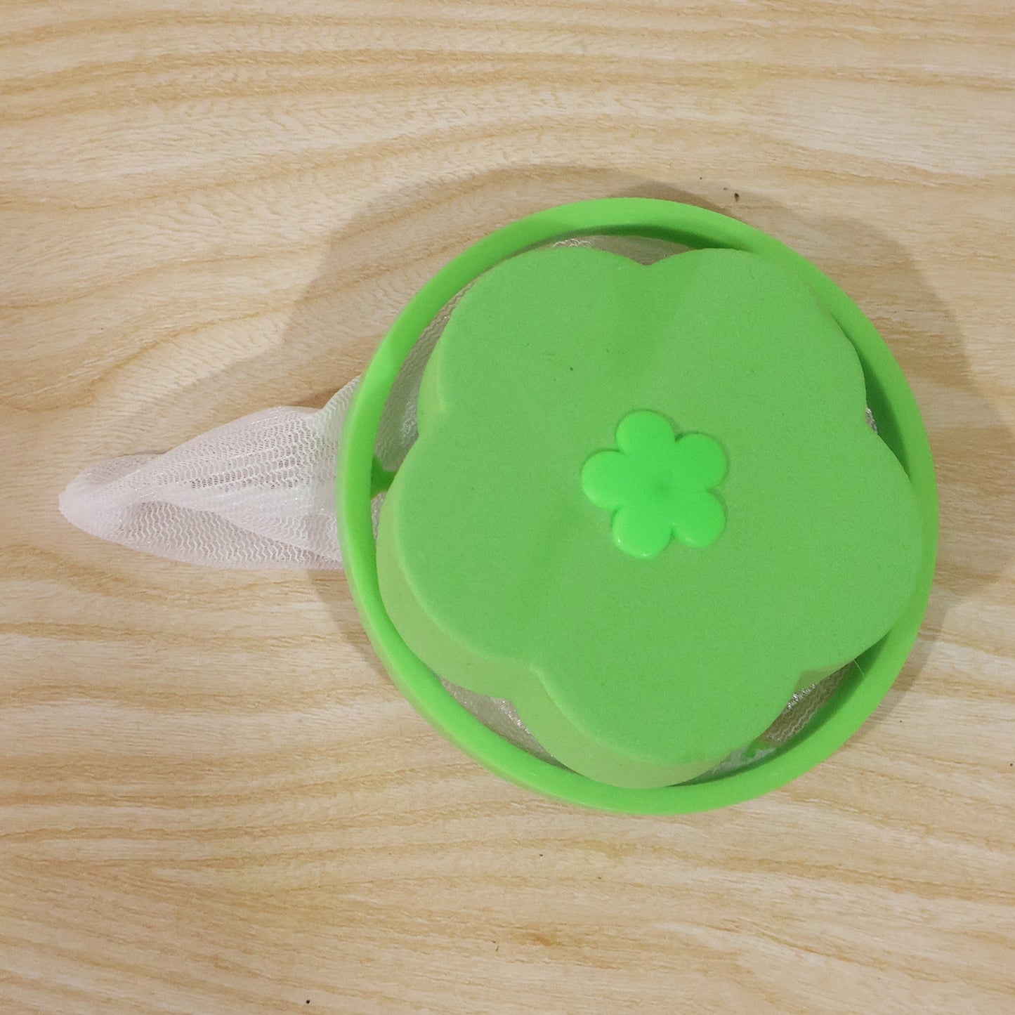 Wukusy reusable mesh flower filter for washing machines, floating hair lint catcher with mesh design for trapping debris.