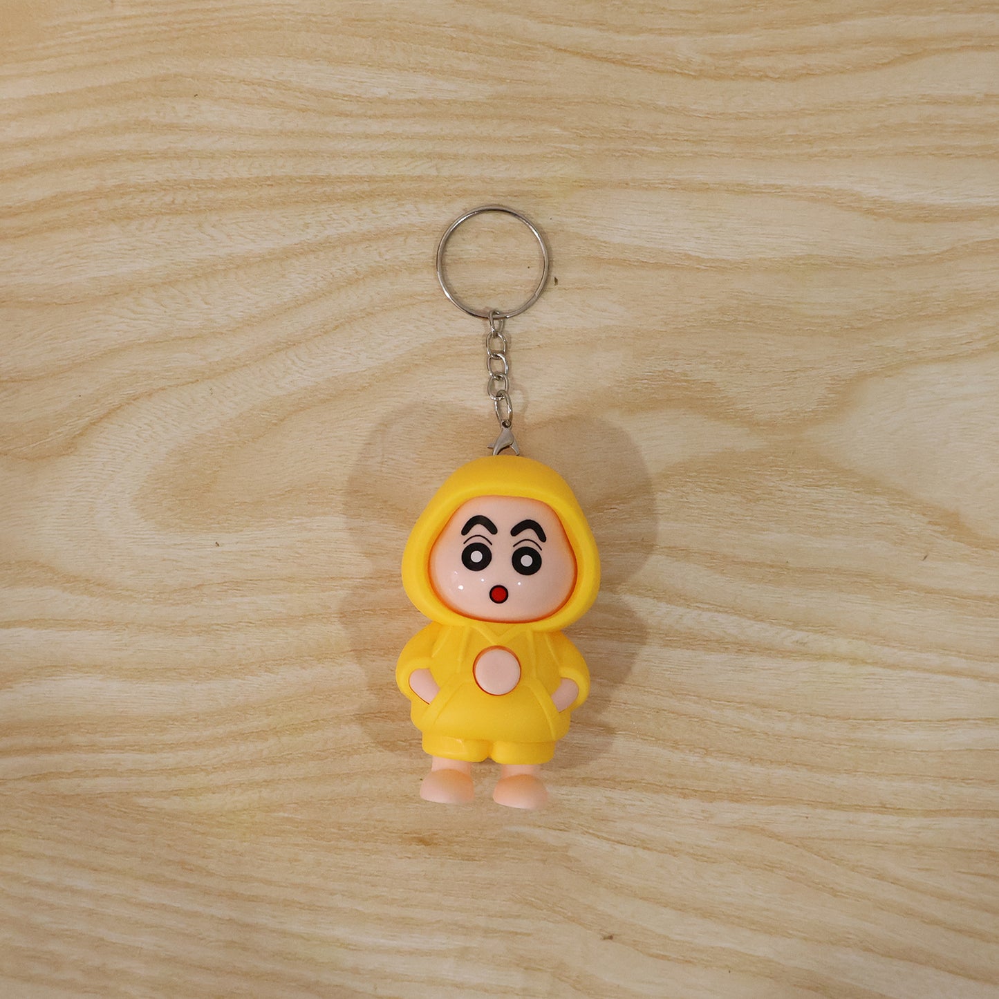 Wukusy cute face-changing doll keychain toy showing a playful, expressive face with vibrant colors and a small keyring attachment
