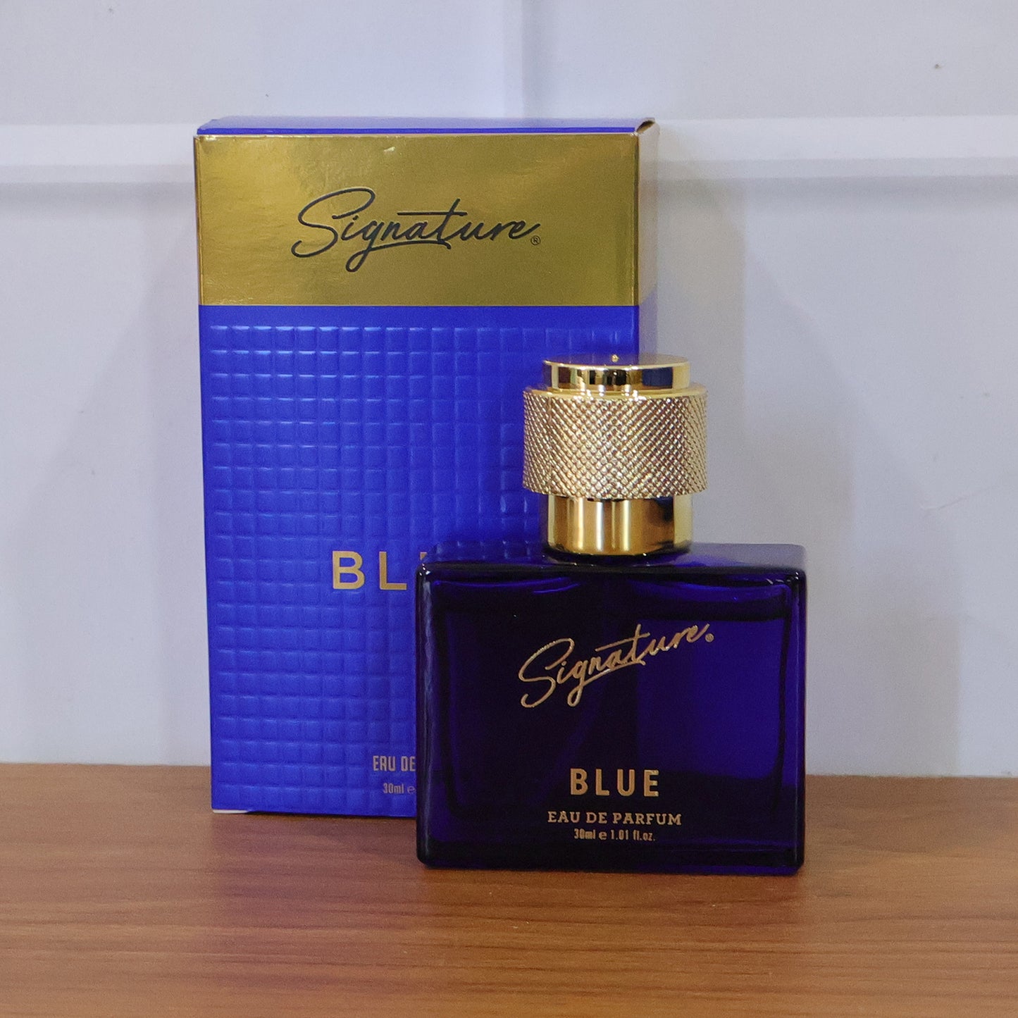 Wukusy Signature Premium Blue Eau De Perfume 30ml bottle with elegant packaging and blue accents, showcasing a luxurious fragrance.