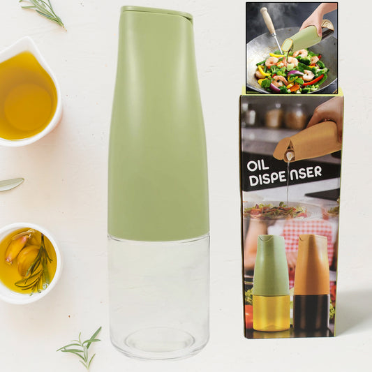 Wukusy 8214 500ml glass oil dispenser with automatic open lid for cooking, grilling, and frying in the kitchen.