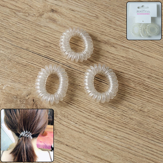 Set of three transparent spiral coil hair bands with matching cases by Wukusy, ideal for secure and stylish hair styling.