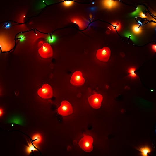 Wukusy flameless LED heart-shaped tea light candles in multi-color, battery operated, ideal for home decor and festive lighting.