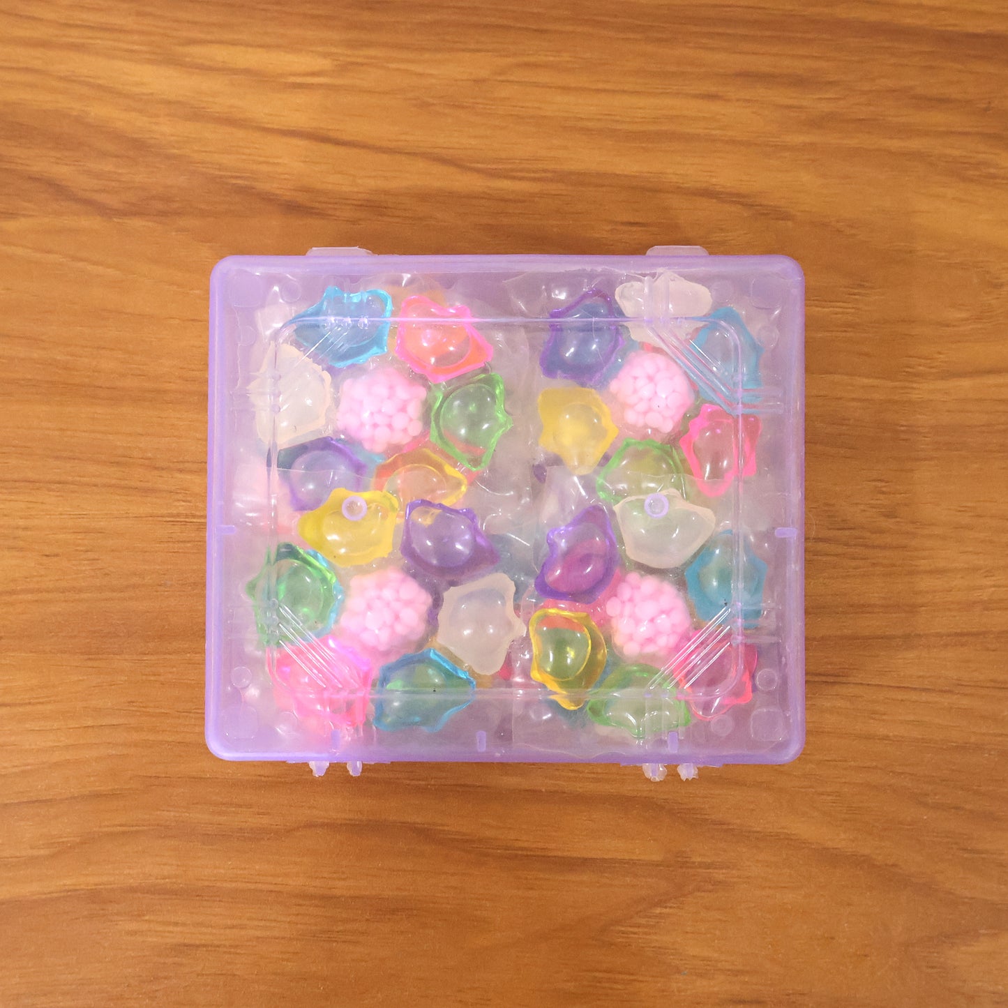 Colorful laundry detergent pods by Wukusy in a 25-piece pack, showcasing vibrant multi-colored capsules for effective cleaning.