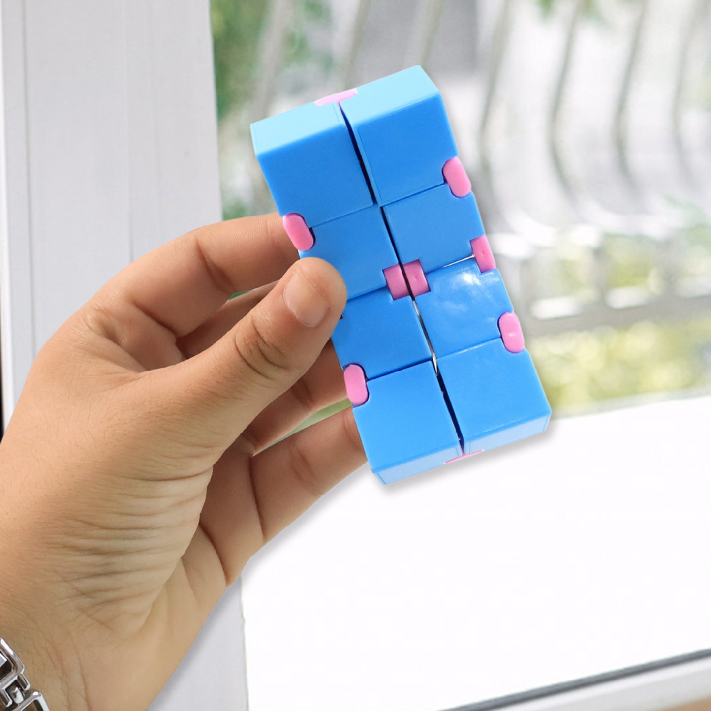 Wukusy infinity cube fidget toy for stress relief, showing a silver metallic hand puzzle for kids and adults.