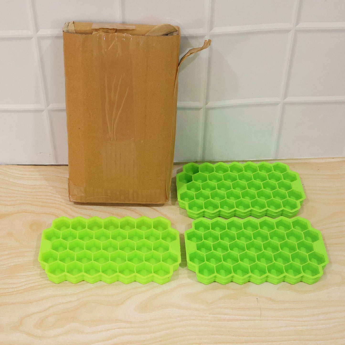 Wukusy silicone honeycomb ice cube tray with 37 cavities for making ice cubes, flexible and reusable kitchen mould.