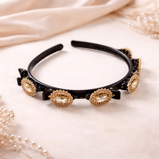 Wukusy gold stone studded designer hair band with elegant embellishments on a black background.