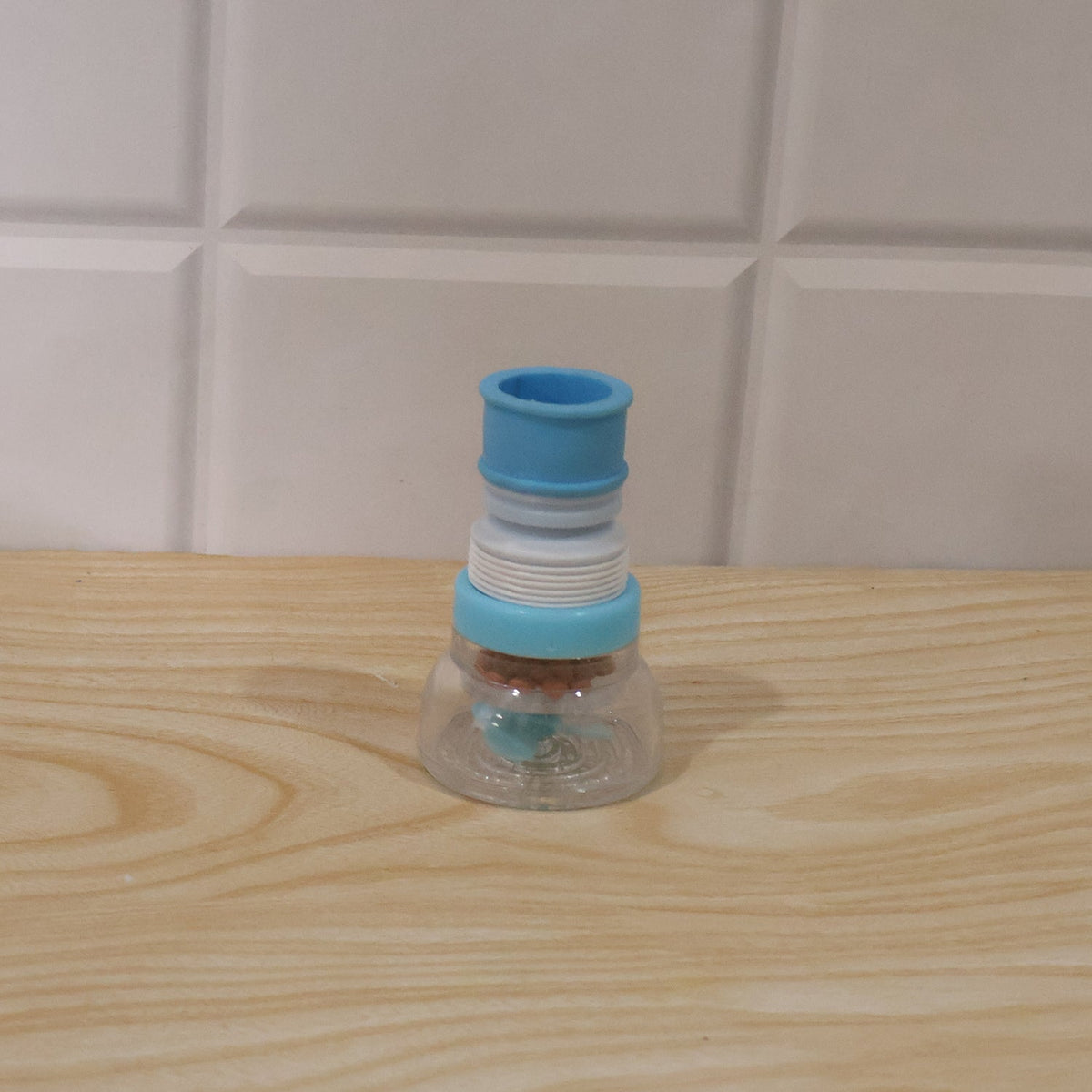 Wukusy plastic faucet water filter aerator attached to kitchen sink tap, splash-free design for improved water flow.