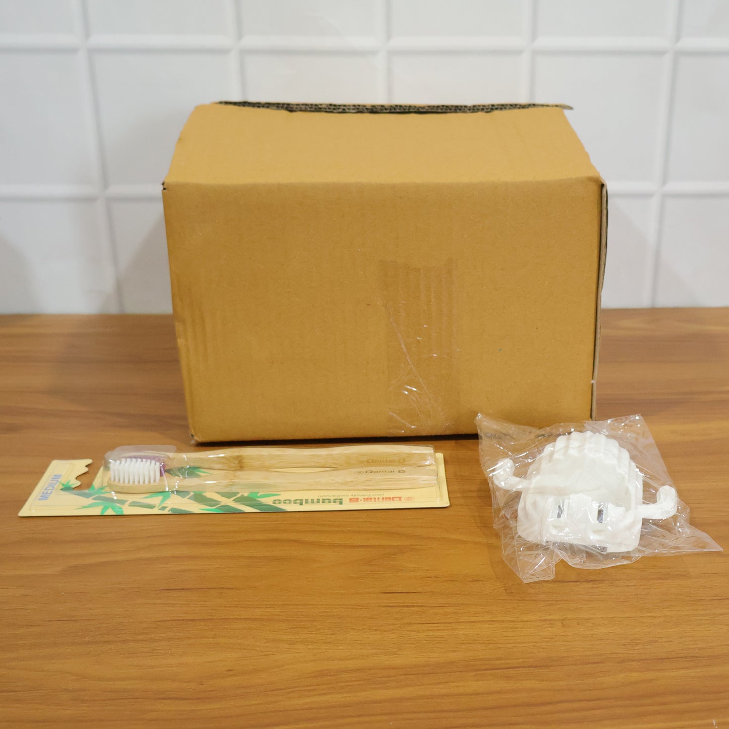Wukusy premium wall-mounted toothbrush holder set with multiple compartments for toothbrushes and toothpaste in a modern bathroom.
