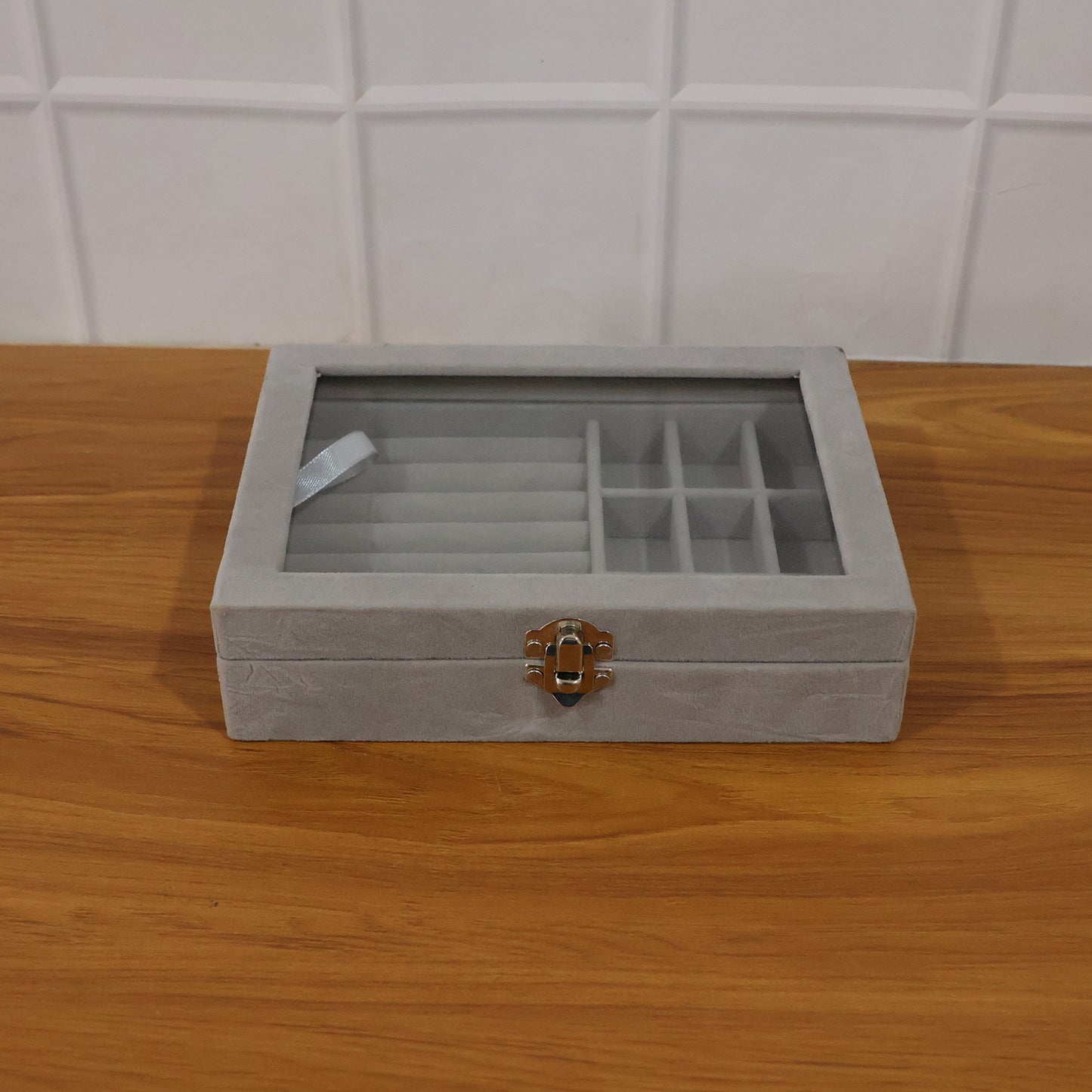 Wukusy premium velvet jewelry organizer box with transparent lid, featuring compartments for necklaces, rings, and earrings.