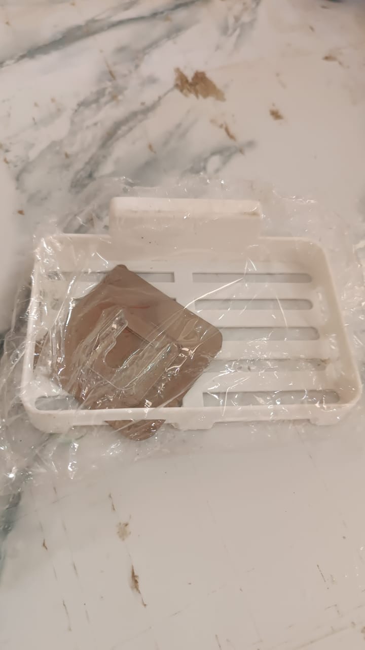 Wukusy self-adhesive plastic soap dish with drain slots mounted on a wall for bathroom home improvement.