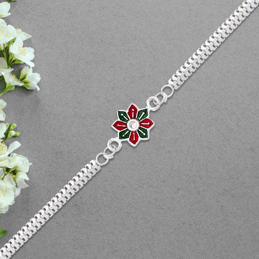 Elegant bracelet-style Rakhi bracelet by Wukusy featuring intricate design and decorative elements on a neutral background.