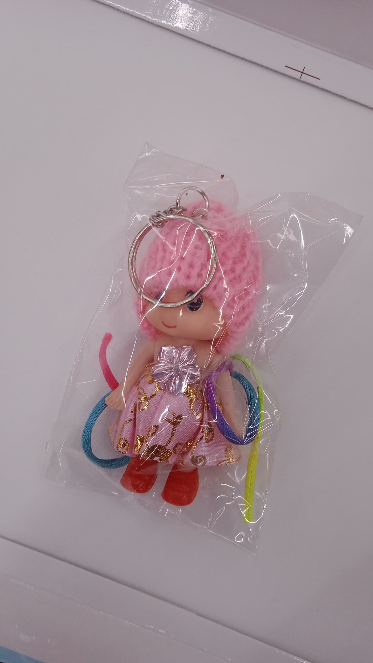 Colorful multifunction doll Rakhi bracelet by Wukusy featuring a soft toy design and keychain for kids, suitable for boys and girls.