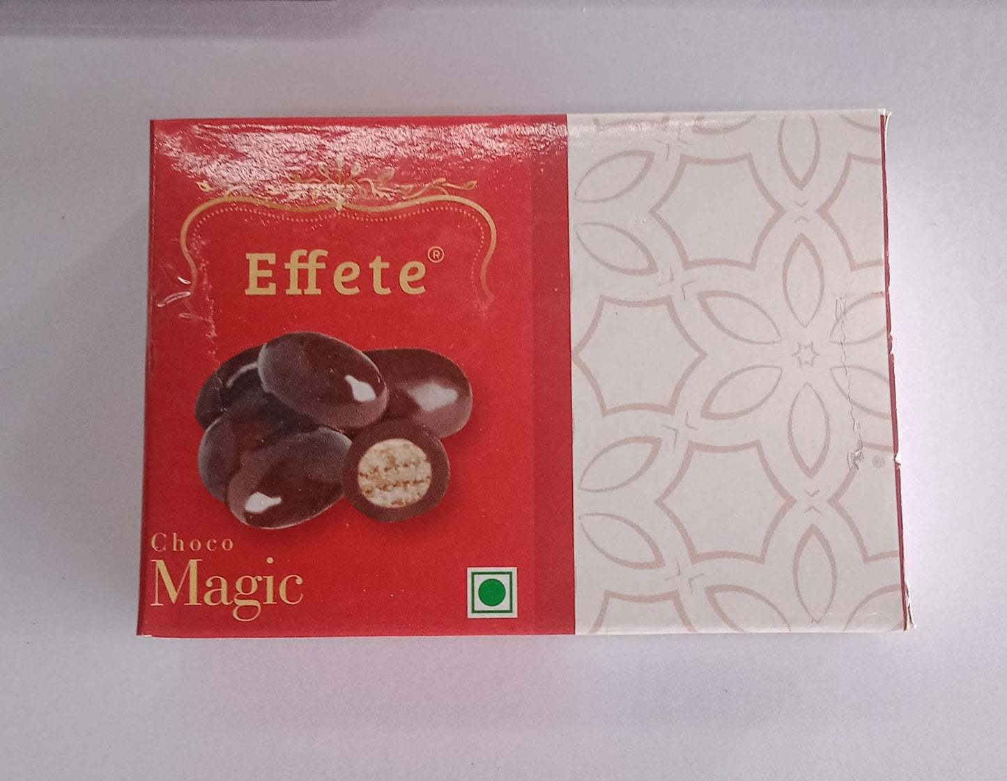 Assorted Wukusy Delicious Choco Magic chocolates displayed in a box with rich, smooth chocolate pieces and decorative packaging.