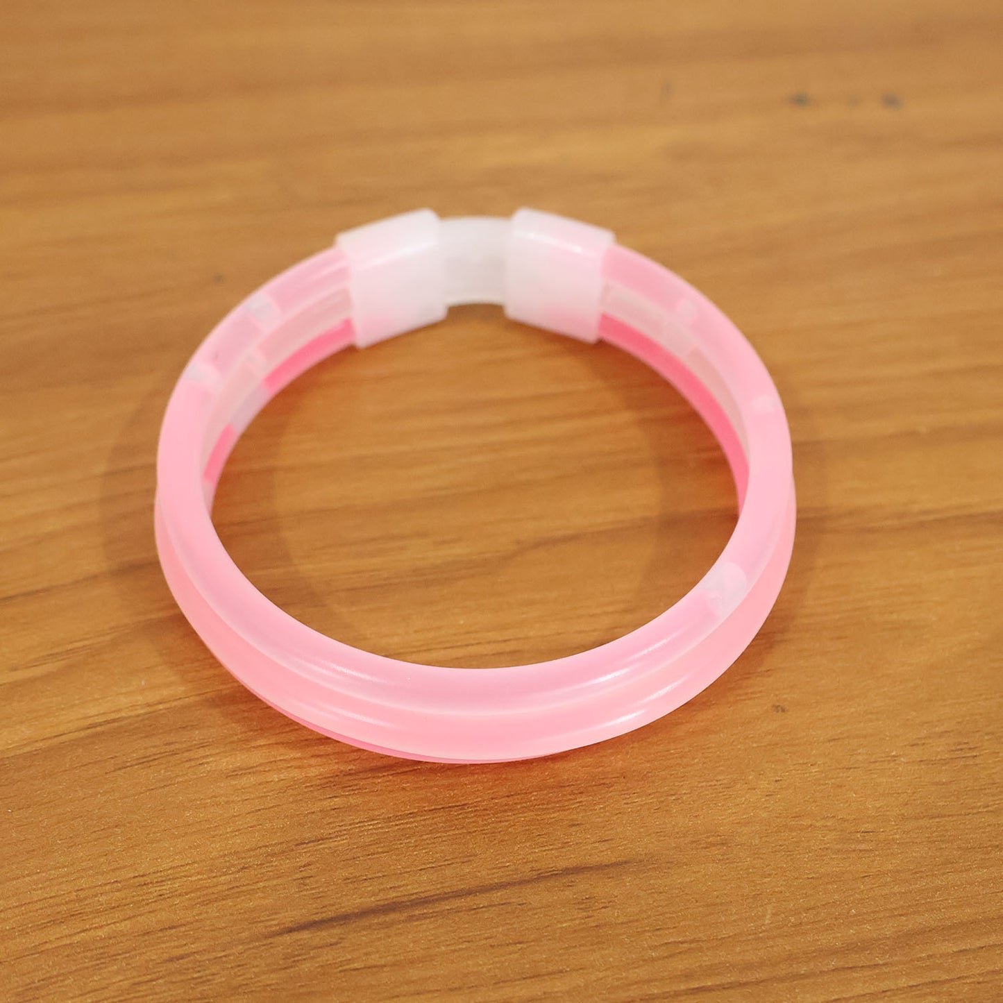 Wukusy 3-in-1 glow bracelet with multiple glowing modes, adjustable band, and vibrant LED lights in a sleek design.