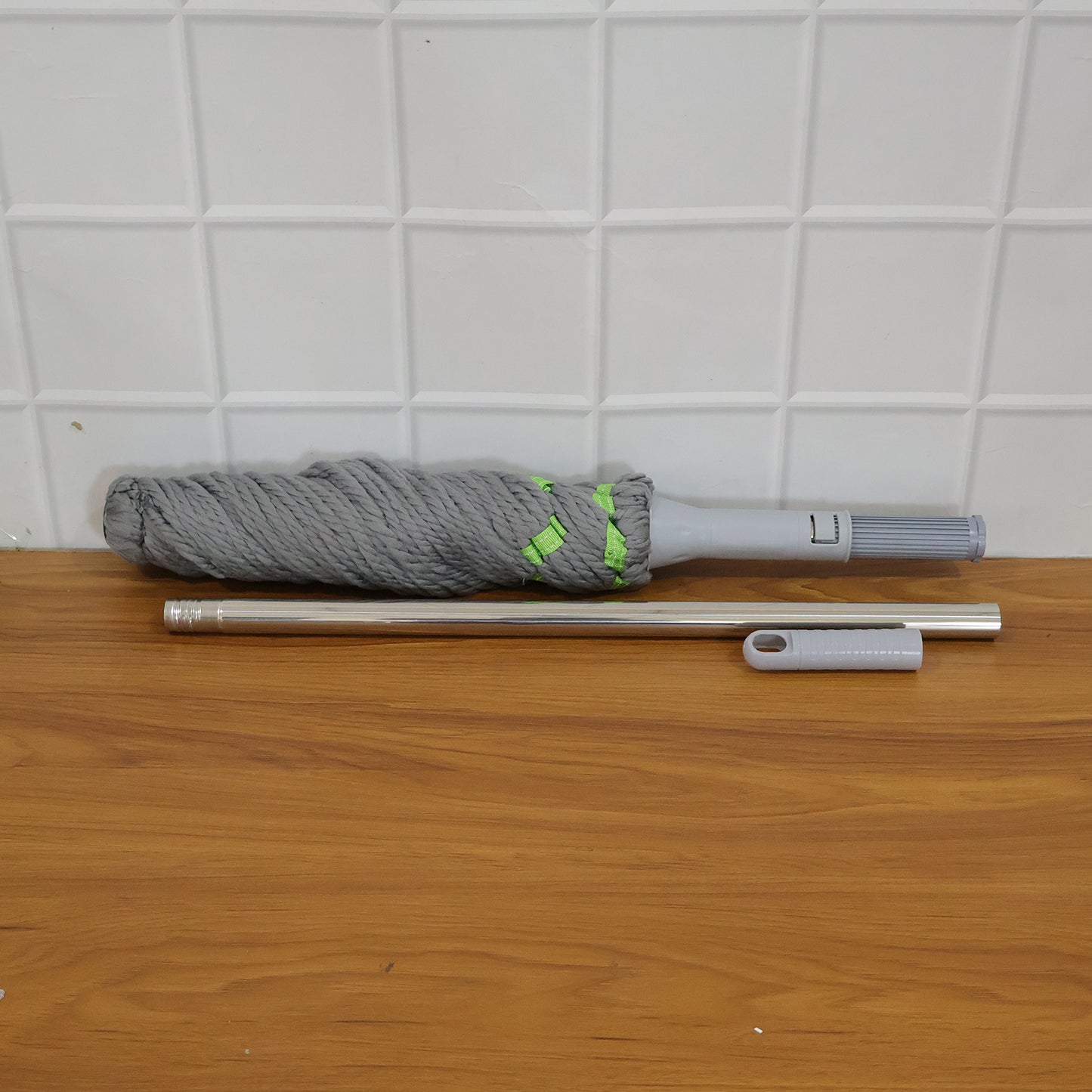 Wukusy 360 Spin Mop for floor cleaning, featuring a rotating head and ergonomic handle for easy mopping and quick drying.