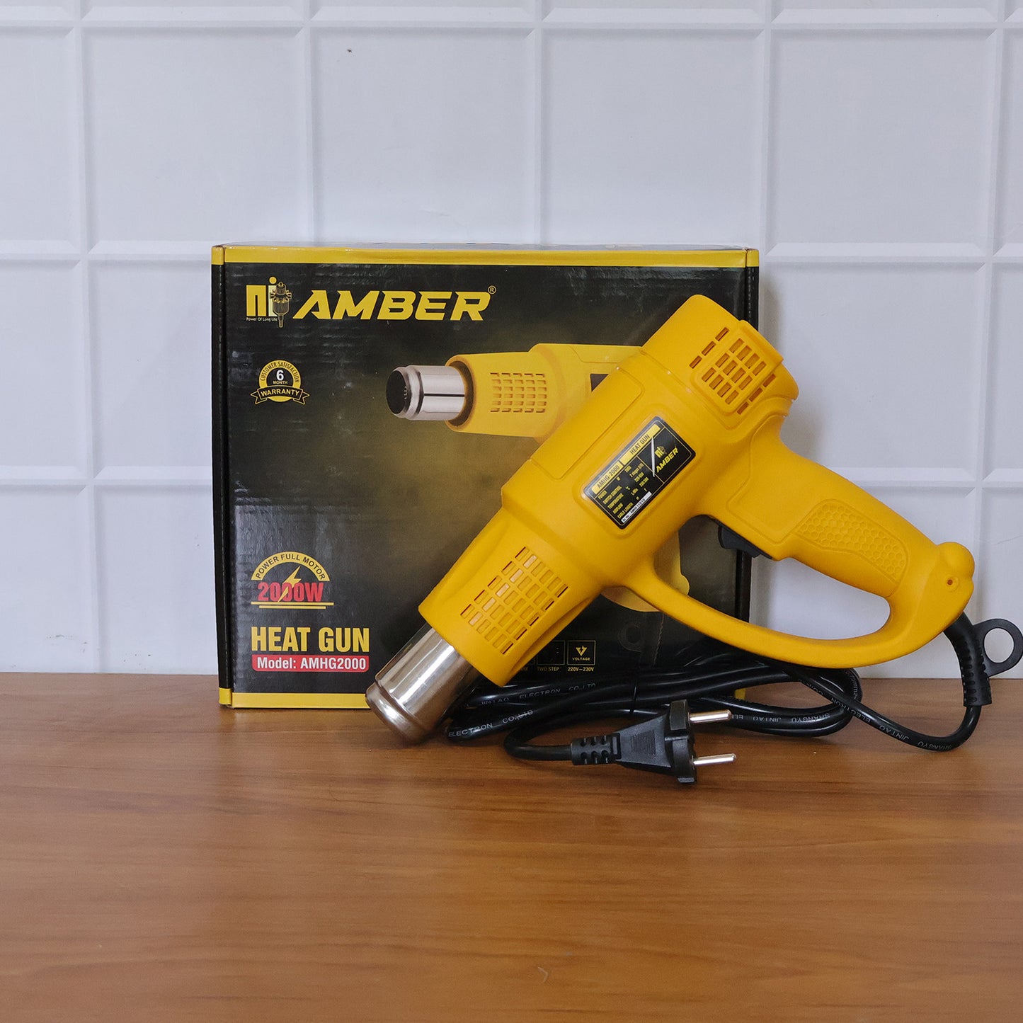 Wukusy Amber Heat Gun AMHG2000 with 2000W power, handheld tool for heat shrinking, stripping, and crafting projects.