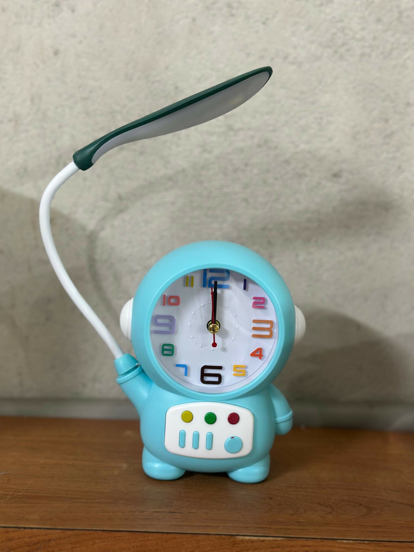 Wukusy astronaut table lamp with built-in clock, perfect for kids' study desks and bedrooms, featuring a fun space-themed design.