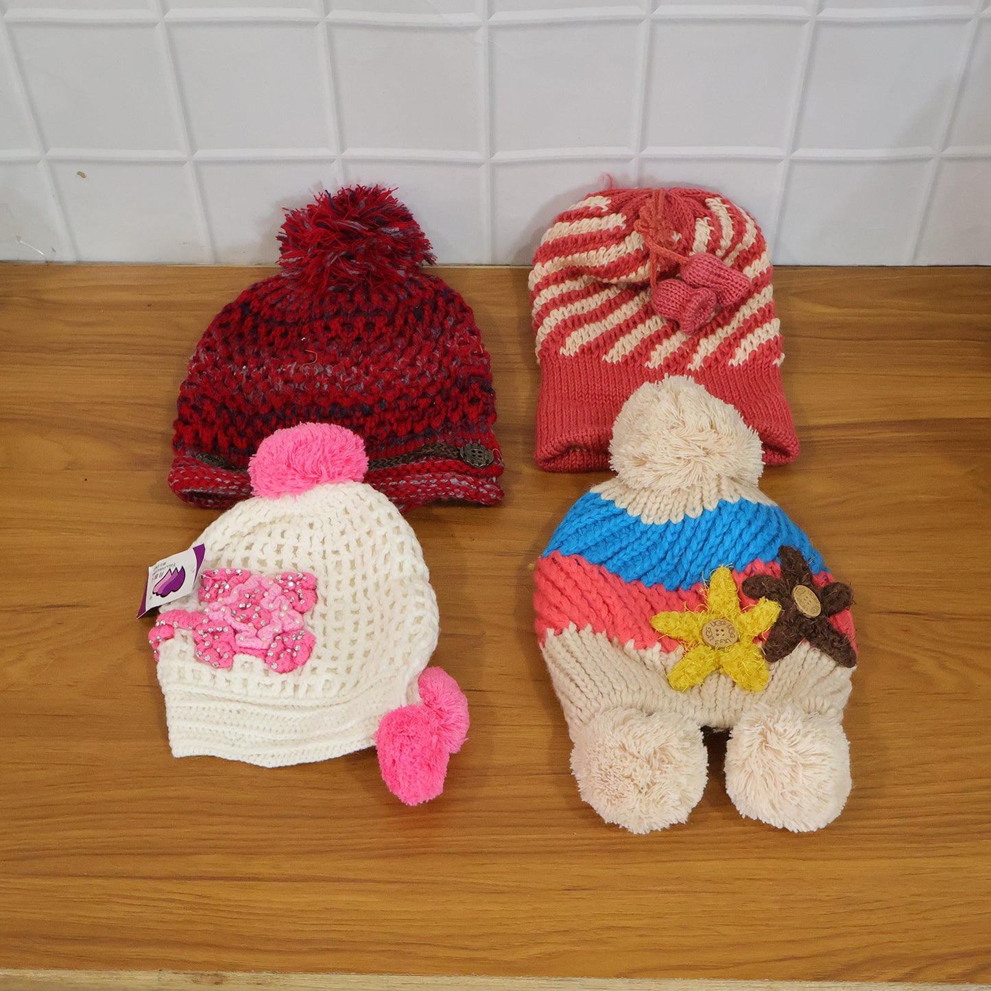Wukusy cute winter woolen knitted cap for men and women in a mix design, featuring cozy, warm knit fabric and stylish winter look.