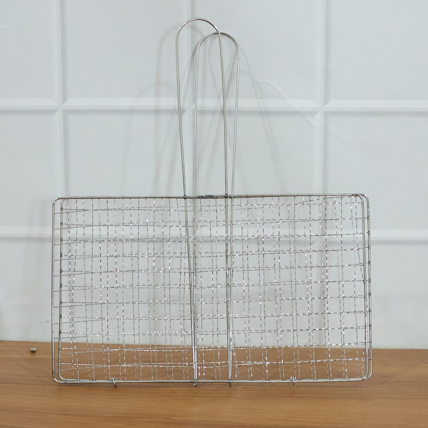 Wukusy heavy-duty stainless steel barbecue grill basket for grilling vegetables, meats, and seafood on outdoor grills.