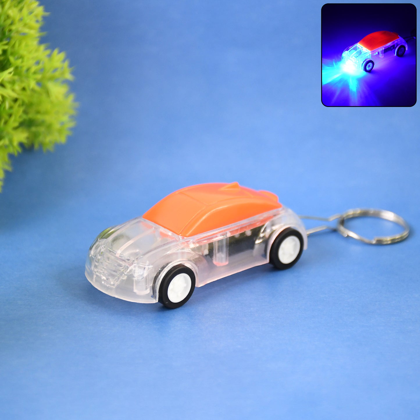 Wukusy mini car shape LED keychain light with random color, compact and portable keychain accessory for keys or bags.