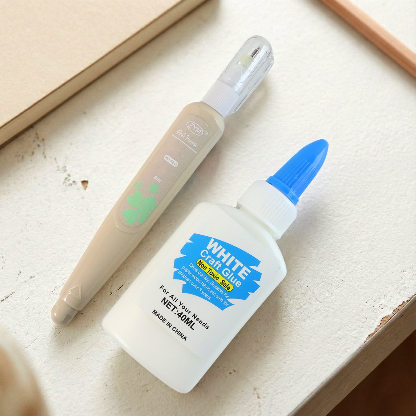Wukusy multipurpose craft glue and correction pen combo set, featuring a white correction pen and versatile craft glue for arts and crafts.